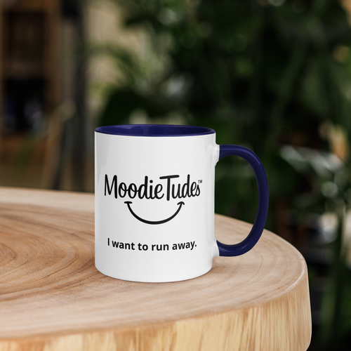 MoodieTudes™ I Want To Run Away mug, lifestyle with logo and tag line visible