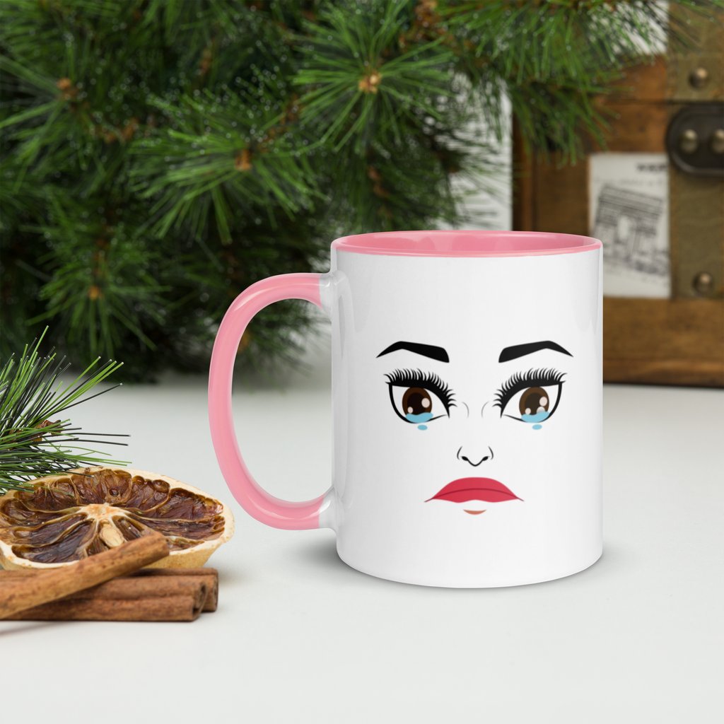MoodieTudes™ Everything Makes Me Cry mug, pink handle, face design, styled lifestyle setting